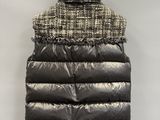 an image of a black and white vest hanging on a wall