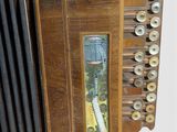a close up of an accordion with buttons on it