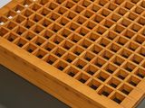 a close up of a wooden table with a drawer underneath it