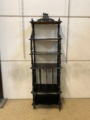 a shelf that has a clock on top of it