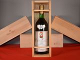 a bottle of wine in a wooden box on a table