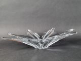 an image of a clear glass candle holder on a table