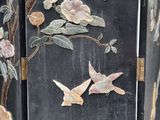 a picture of a room divider with birds and flowers on it
