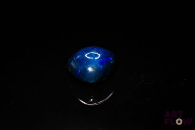 a picture of a blue stone with a smiley face on it