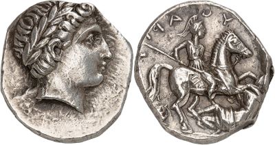 a silver coin with an image of a man riding a horse