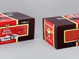 pair of two boxes of coffee sitting on top of a white surface
