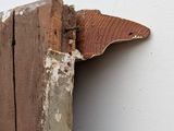 a piece of wood sticking out of the corner of a wall
