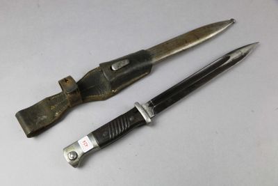 two knives that are sitting next to each other on a table