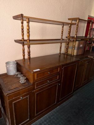 a wooden shelf with a book shelf on top of it