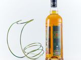 an image of a bottle of alcohol next to a wire