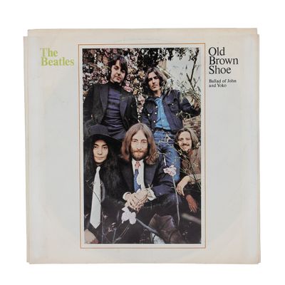 an old brown album with a picture of the beatles