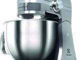 a large silver mixer with a metal bowl on it