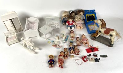 many figurines that are sitting on a white table