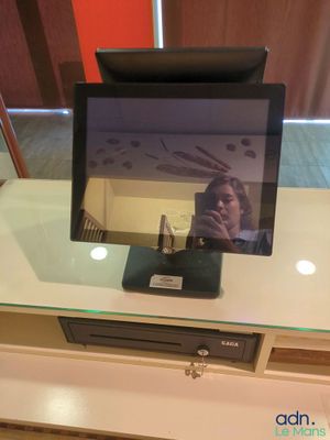 a television sitting on top of a table with a glass top