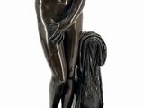 statue of a woman with a dog on a pedestal