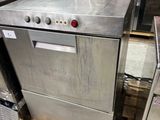 several stainless steel appliances are stacked on pallets in a warehouse