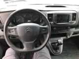 the interior of a car with a steering wheel and dashboard