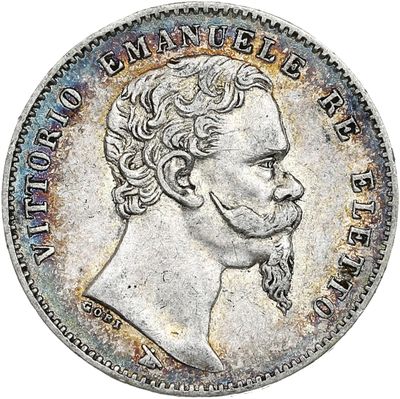 une pièce en argent avec l'image d'un homme de profil
