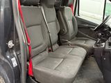 the interior of a van with four seats and a steering wheel