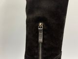 a close up of a pair of black boots with a zipper