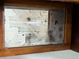 a small window with a lot of dirt on it