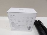 a box and a pen sitting on a table