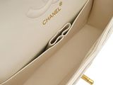 the inside of a chanel bag with a gold handle