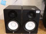 two speakers that are sitting on a table