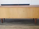 an image of a wooden cabinet with a laptop on top of it