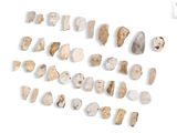 many different types of rocks on a white surface
