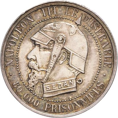 une vieille pièce d'argent sur laquelle figure une tête d'homme
