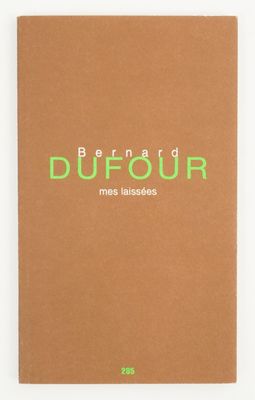 a brown notebook with green lettering on the front of it