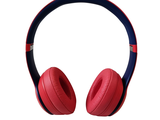a pair of red and blue headphones on a white background