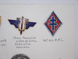 a lot of badges that are on a piece of paper