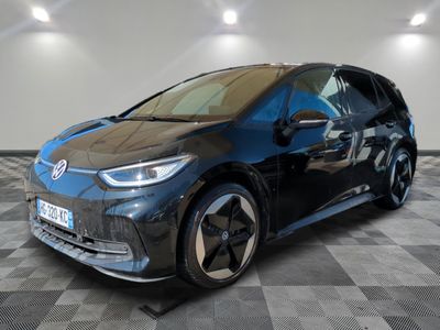 bmw i3 electric car on a checkered floor in a showroom