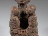 an image of a statue of a man holding a baby