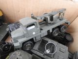a toy truck that is in a box with other toys
