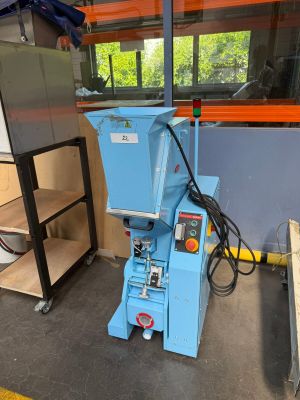 a blue machine that is sitting in a room