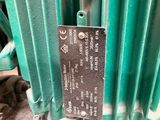 a close up of a green and white electric heater
