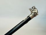 an image of a close up of a metal stick with a hand on it
