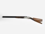 a shotgun with a wooden handle on a white background