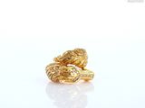 an image of a pair of gold rings with diamonds on a white surface