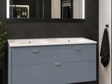 a bathroom with a sink and a mirror in it