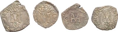 four different types of silver coins on a white background