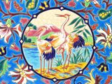 two birds that are standing in the middle of a tile