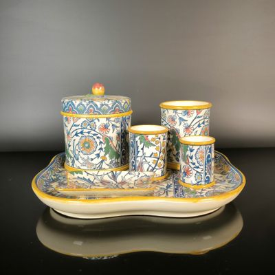 a picture of a set of three cups and saucers