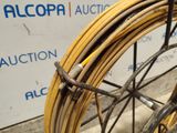 a close up of a bicycle tire with a bunch of wires attached to it
