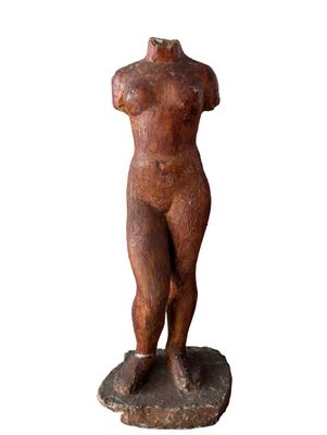 statue of a woman standing on a stone base with her hands on her hips