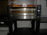 an image of a commercial pizza oven in a kitchen