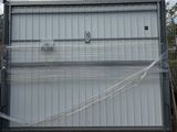 a picture of a large metal container with a net covering it